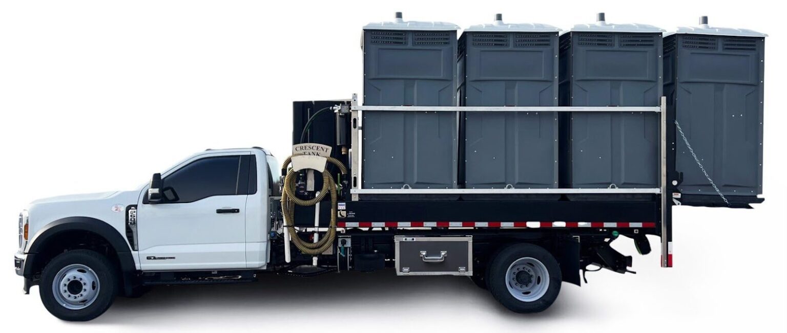Flat vacuum tank truck with Ford chassis.