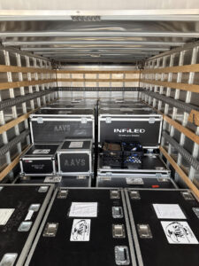 2022 Isuzu FTR commercial box truck packed full for a concert and trade show production